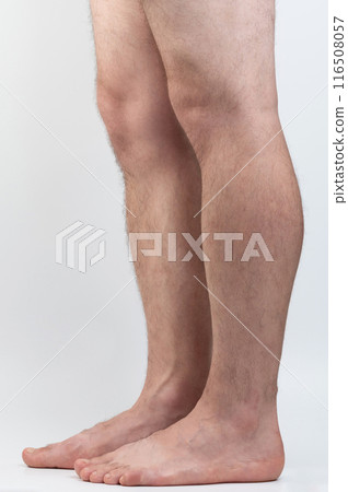 Profile of man hairy barefoot legs 116508057