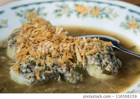 Lontong Kupang Surabaya or compressed rice cake of Surabaya served small mussels 116508159