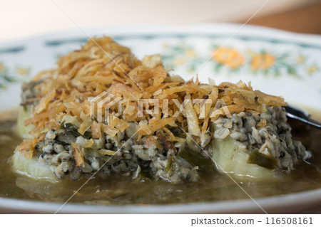 Lontong Kupang Surabaya or compressed rice cake of Surabaya served small mussels 116508161