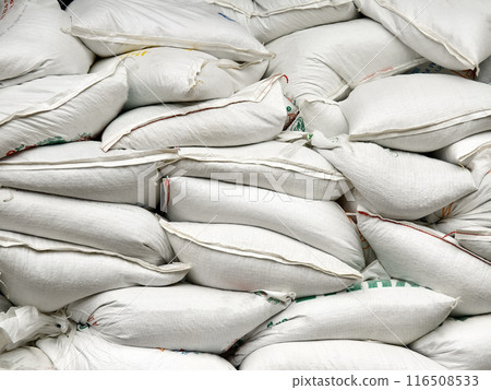 Stacking of big white bags in the modern warehouse Stacking of big white bags in the modern warehouse 116508533