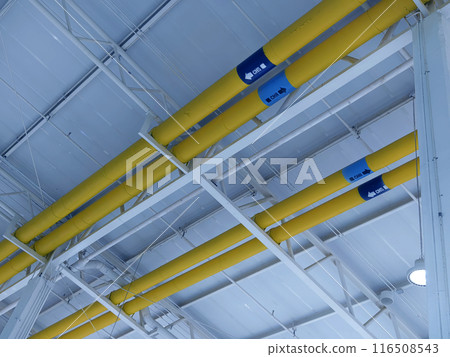 Ceiling with ventilation pipes and lights in industrial building Ceiling with ventilation pipes and lights in industrial building 116508543