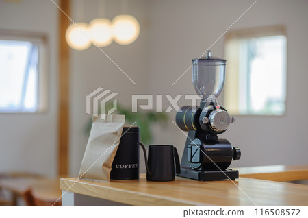 Coffee mill, drip pot, and canister on the table Coffee mill, drip pot, and canister on the table 116508572