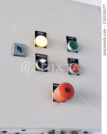 Industrial control panel with start, stop, and emergency buttons 116508877