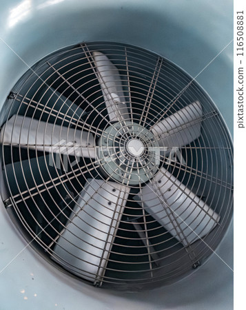Close-up of a large, gray, industrial fan Close-up of a large, gray, industrial fan 116508881
