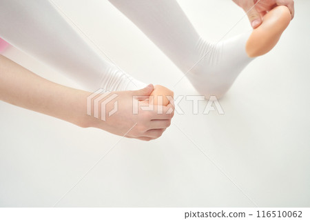 Young ballet girl at studio lesson. Training performance. Stretching exercise 116510062