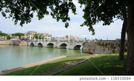 Historical roman Tiberius Bridge over Marecchia river in Rimini at Italy 116510084