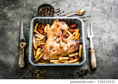 Fried turkey wing with fries in baking tray top view 116510315