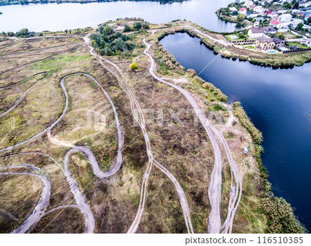 rolled tracks in countryside terrain, top view rolled tracks in countryside terrain, top view 116510385