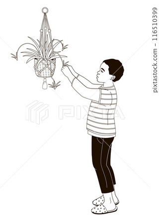 African American character boy and houseplant chlorophytum in a hanging pot 116510399