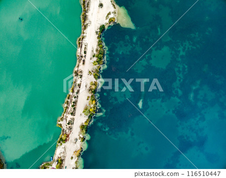 sandy shore with colourful water sandy shore with colourful water 116510447