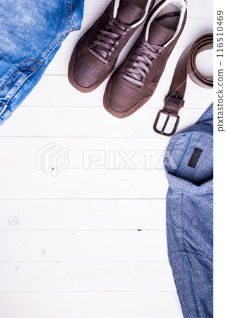 male clothes on wooden background with text space 116510469