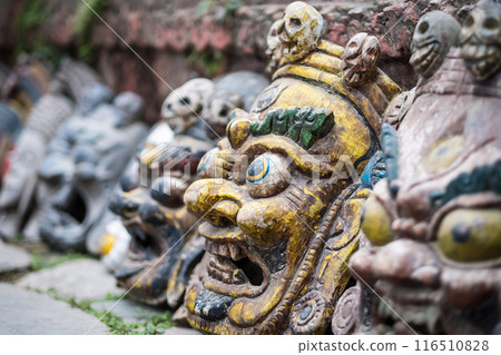 Souvenir masks on Nepalese market 116510828
