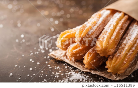 Closeup of churros  on rustic wooden background 116511399