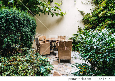 Cozy Garden Patio with Wicker Furniture Cozy Garden Patio with Wicker Furniture 116513068