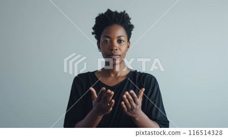 The interpreter using the hand signal with grey background as wallpaper. AIG43. 116514328
