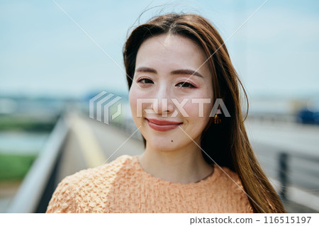 A young woman looking at the camera A young woman looking at the camera 116515197