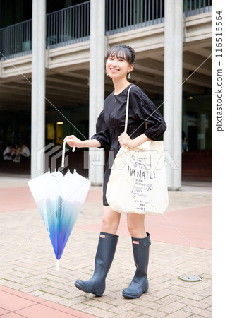 Female college student walking on campus 116515564