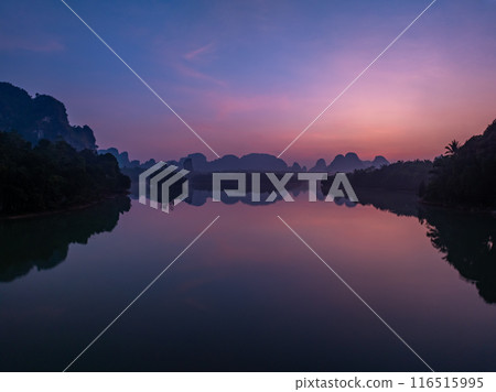 Landscape Aerial view of majestic clouds in the sky sunset or sunrise over sea with reflection in the tropical sea.Beautiful landscape scenery.Amazing light of nature Landscape nature background 116515995