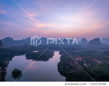 Landscape Aerial view of majestic clouds in the sky sunset or sunrise over sea with reflection in the tropical sea.Beautiful landscape scenery.Amazing light of nature Landscape nature background Landscape Aerial view of majestic clouds in the sky sunset or sunrise over sea with reflection in the tropical sea.Beautiful landscape scenery.Amazing light of nature Landscape nature background 116516000