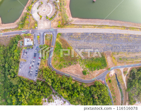 Aerial view drone shot of parking lot outdoors vehicles in the park 116516078