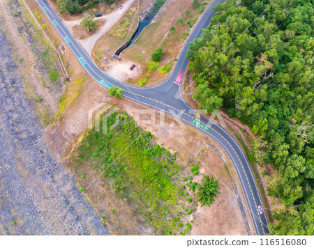 Aerial view Curve road top view rainforest trees summer background 116516080