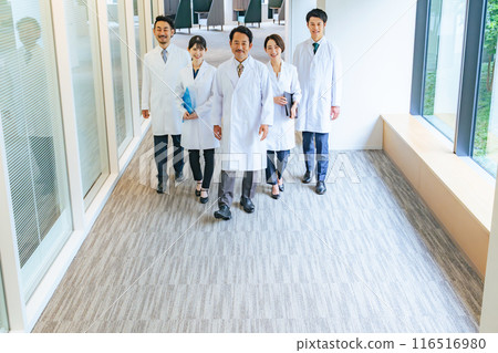 A group of white coats walking down the aisle doctor university medical office hospital scientist 116516980