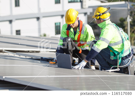 Professional electric engineers survey and inspect solar panels installation on the factory metal sheet roof top, electric engineer team inspecting and check solar cell system. Professional electric engineers survey and inspect solar panels installation on the factory metal sheet roof top, electric engineer team inspecting and check solar cell system. 116517080