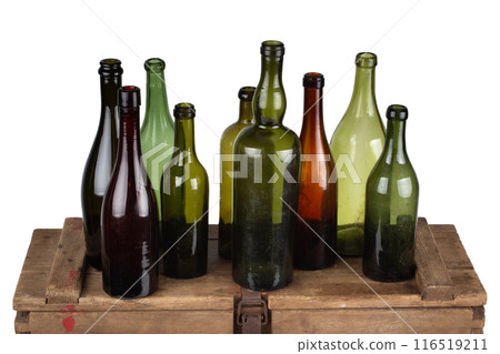 Antique retro green glass bottles on wooden box Antique retro green glass bottles on wooden box 116519211