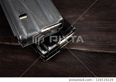 Ammunition with magazine on wooden table Ammunition with magazine on wooden table 116519229