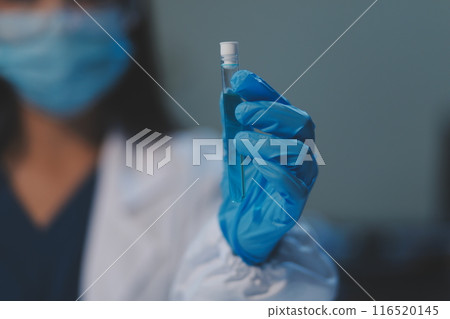 Group of dedicated scientist conduct chemical experiment in medical laboratory, carefully drop precise amount of liquid from pipette into test tube for vaccine drug or antibiotic development. Neoteric Group of dedicated scientist conduct chemical experiment in medical laboratory, carefully drop precise amount of liquid from pipette into test tube for vaccine drug or antibiotic development. Neoteric 116520145