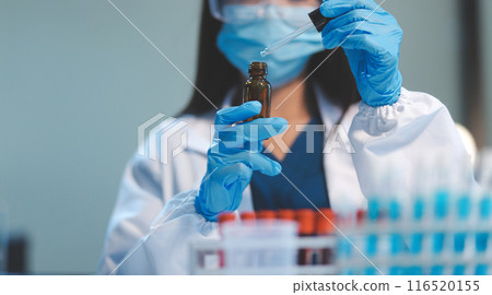 Group of dedicated scientist conduct chemical experiment in medical laboratory, carefully drop precise amount of liquid from pipette into test tube for vaccine drug or antibiotic development. Neoteric Group of dedicated scientist conduct chemical experiment in medical laboratory, carefully drop precise amount of liquid from pipette into test tube for vaccine drug or antibiotic development. Neoteric 116520155