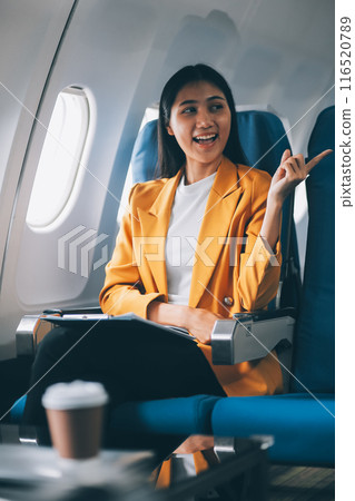 Female airplane passengers asian chinese people Entrepreneurs on Flight, Venturing Overseas Investments. Global Business Expansion, Foreign Markets, Strategic Financial Moves. Women in Business Suits Female airplane passengers asian chinese people Entrepreneurs on Flight, Venturing Overseas Investments. Global Business Expansion, Foreign Markets, Strategic Financial Moves. Women in Business Suits 116520789