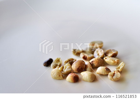 Hand-picking defective beans 116521853