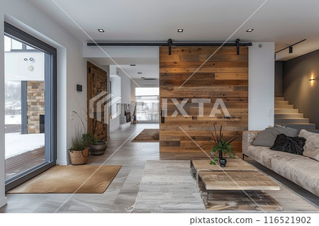 Modern home interior with a wooden sliding door. 116521902