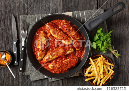 German Currywurst, pork sausages in a curry sauce German Currywurst, pork sausages in a curry sauce 116522715