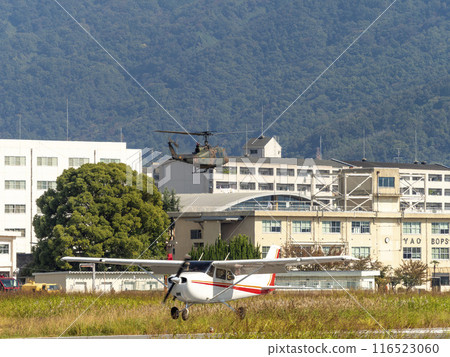 A UH-1J utility helicopter flying over Yao Garrison. A UH-1J utility helicopter flying over Yao Garrison. 116523060
