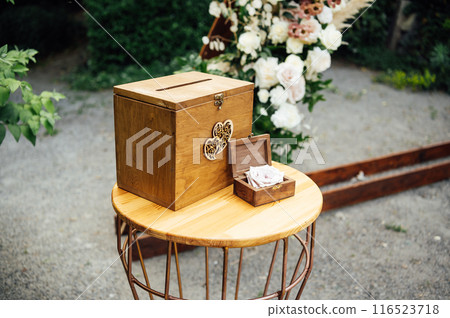 Wedding ceremony. Wedding rings are in beautiful box on the table Wedding ceremony. Wedding rings are in beautiful box on the table 116523718