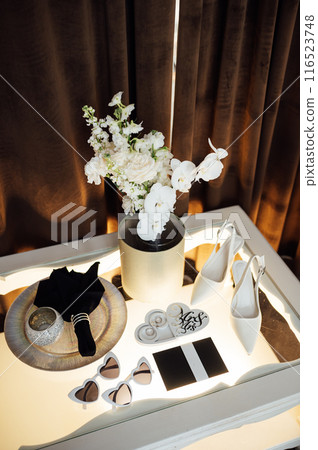 Wedding invitations. Wedding details of the bride. Bridal bouquet and other accessories. Shoes of the bride 116523748