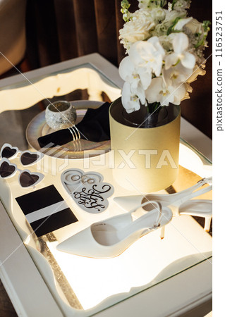 Wedding invitations. Wedding details of the bride. Bridal bouquet and other accessories. Shoes of the bride 116523751