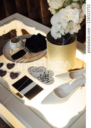 Wedding invitations. Wedding details of the bride. Bridal bouquet and other accessories. Shoes of the bride 116523752