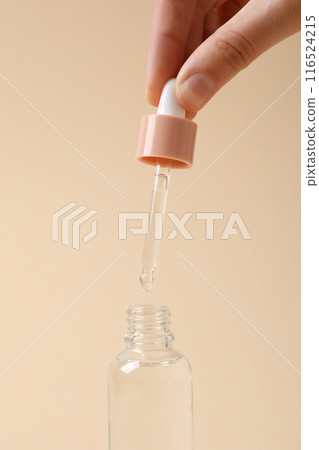 Hyaluronic acid in a glass bottle with a dropper. Hyaluronic acid in a glass bottle with a dropper. 116524215