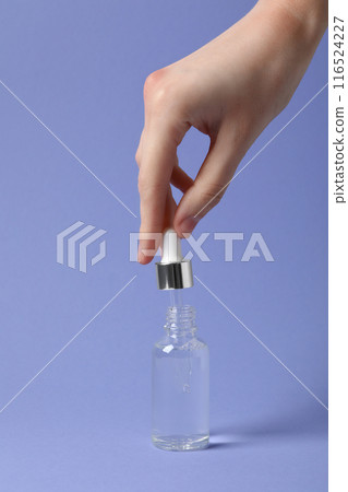 Hyaluronic acid in a glass bottle with a dropper. 116524227