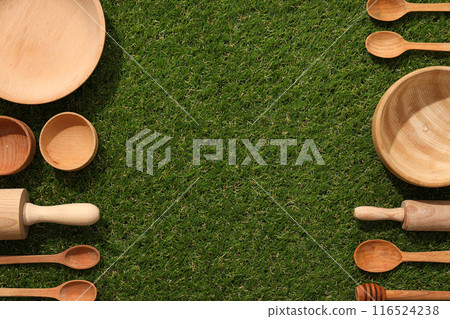 Reusable tableware made of wood on grass. Reusable tableware made of wood on grass. 116524238