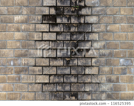 Stock image of an exterior wall made of stacked blocks 116525395