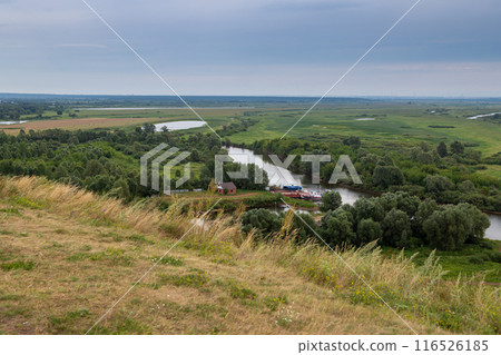 View of Kama River. Mouth of Toima River. Toyma flows into Kama near town Yelabuga, Russia. Summer natural landscape View of Kama River. Mouth of Toima River. Toyma flows into Kama near town Yelabuga, Russia. Summer natural landscape 116526185