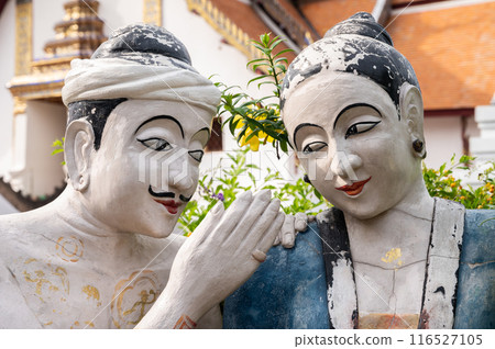 The sculpture of Lanna peoples in front of beautiful viharn in Wat Phumin the most attractive temple in the town of Nan province. The sculpture of Lanna peoples in front of beautiful viharn in Wat Phumin the most attractive temple in the town of Nan province. 116527105