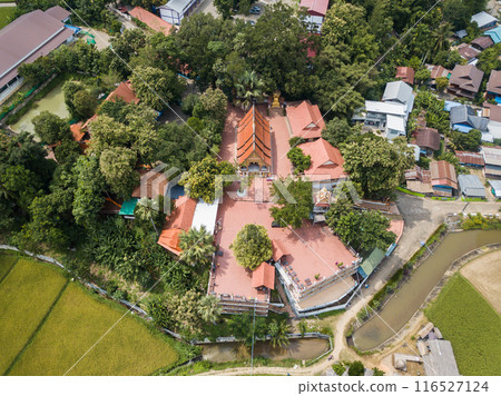 Aerial view of Wat Phuket a popular temple located in Pua district, Nan province of Thailand view from drone. Aerial view of Wat Phuket a popular temple located in Pua district, Nan province of Thailand view from drone. 116527124