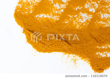 A smear of turmeric on a white background, top view 116528070