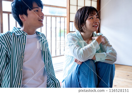 A young couple relaxing in a Japanese-style room A young couple relaxing in a Japanese-style room 116528151