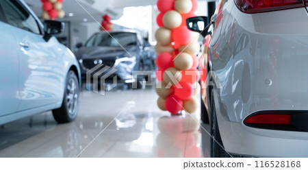 Car parked in luxury showroom. Car dealership office decorate with balloons. New car parked in modern showroom. Car for sale and rent business. Automobile leasing and insurance. Electric automobile. 116528168